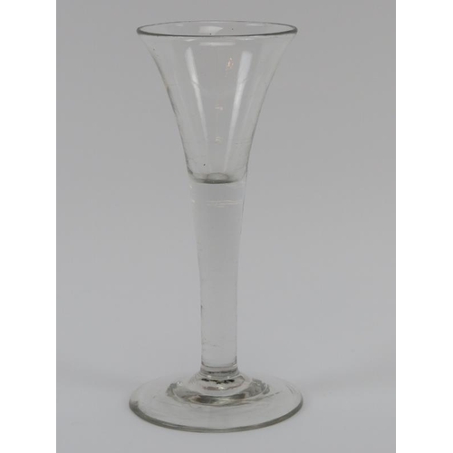 85 - A Georgian period English wine glass, mid 18th century. With an trumpet shaped bowl. 17 cm height. C... 