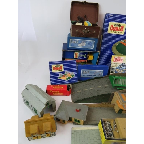 214 - A large quantity of Hornby Dublo 00 gauge railway set accessories including many boxed items. (qty).... 