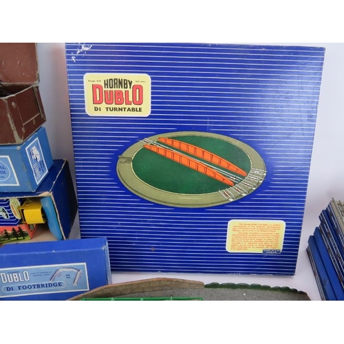 214 - A large quantity of Hornby Dublo 00 gauge railway set accessories including many boxed items. (qty).... 