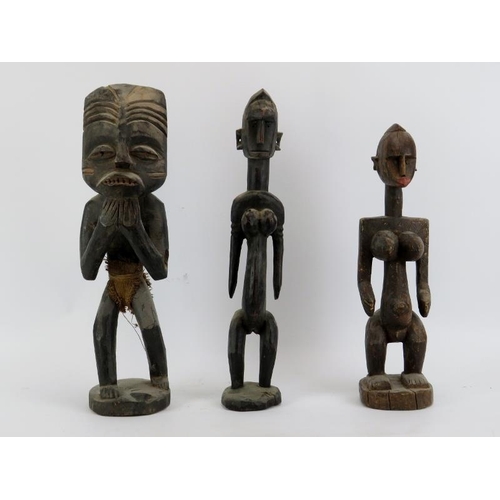 231 - Three African carved wood figures. (3 items) 50 cm tallest height. 

Condition report: Light age rel... 