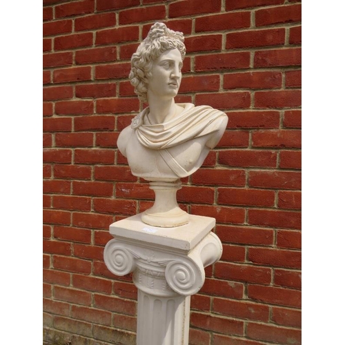 701 - A reconstituted marble bust in the Classical taste modelled as Apollo Belvedere, on an Ionic column ... 