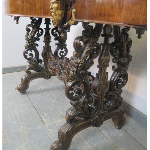 705 - An exceptional 19th century mahogany centre table, the shaped top above a plain frieze with four ind... 