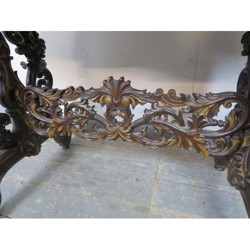 705 - An exceptional 19th century mahogany centre table, the shaped top above a plain frieze with four ind... 