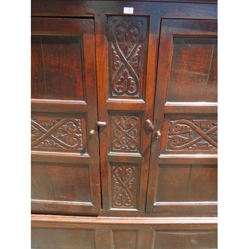 709 - A 17th century oak livery cupboard of good colour, having relief carved decoration and fielded side ... 