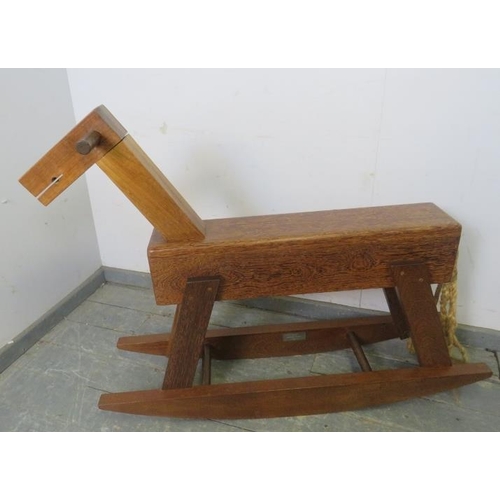 717 - A bespoke modernist rocking horse constructed using a variety of specimen hardwoods, with braided ro... 