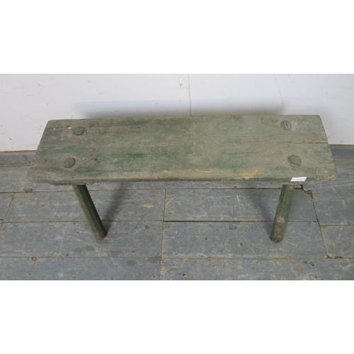 730 - A 19th century primitive bench, with antique green paint wash, on canted octagonal supports. 
H40cm ... 