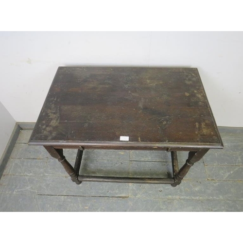 737 - An early 18th century oak side table, on turned and block supports with stretchers. 
H74cm W87cm D56... 