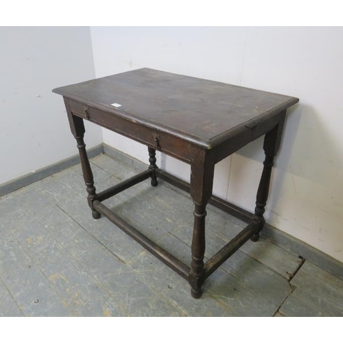 737 - An early 18th century oak side table, on turned and block supports with stretchers. 
H74cm W87cm D56... 