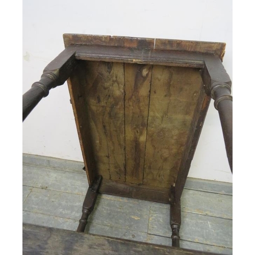 737 - An early 18th century oak side table, on turned and block supports with stretchers. 
H74cm W87cm D56... 