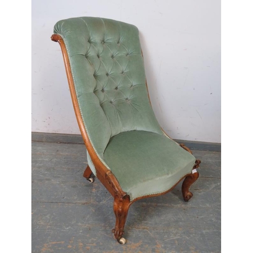 756 - A 19th century walnut slipper chair, the scrolled back reupholstered in buttoned teal velvet materia... 