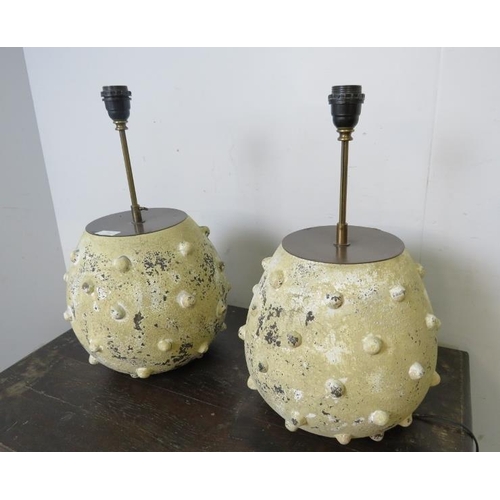 761 - A pair of coastal style pottery table lamps, having height adjustable brass fittings, the bases pain... 