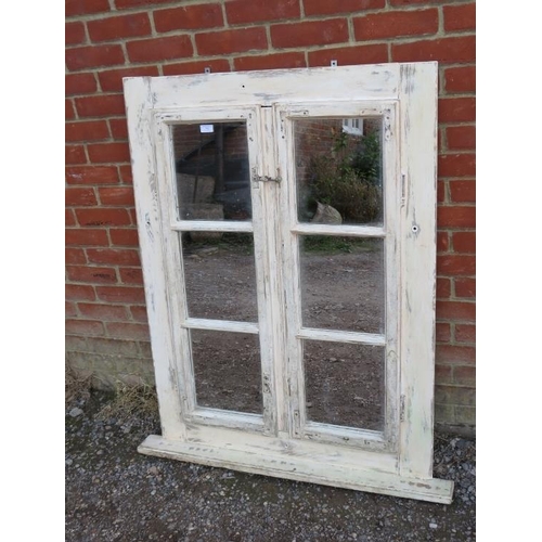 762 - A large bespoke oak framed overmantle mirror, comprised of an antique window with brass fittings, pa... 