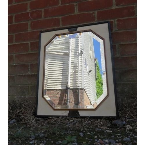 780 - A mid-century Art Deco Revival bevelled wall mirror, within a cream leather part ebonised surround. ... 