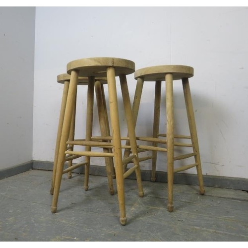 782 - Three beech artist’s stools with pierced seats, on turned supports with double side stretchers. 
H10... 