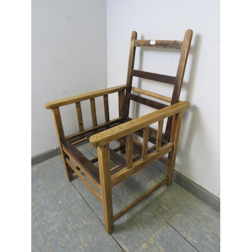 783 - A vintage light oak reclining open-sided studio chair, on square supports with stretchers. 
H99cm W5... 