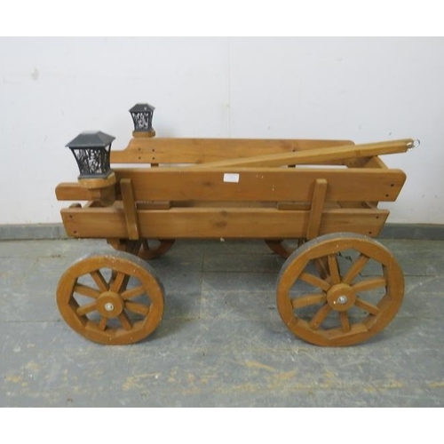 787 - An antique style child’s miniature horse-drawn wagon, with removeable traces, bench seating and sola... 