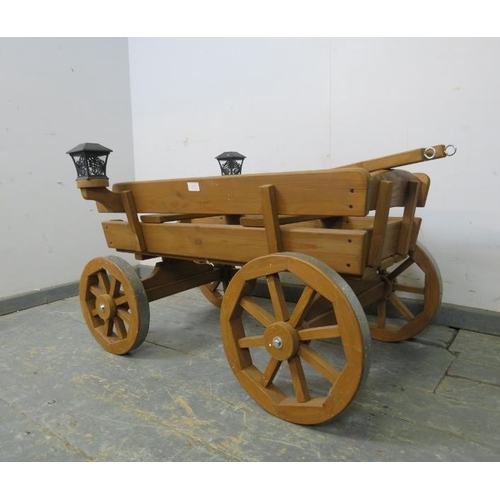 787 - An antique style child’s miniature horse-drawn wagon, with removeable traces, bench seating and sola... 