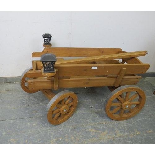 787 - An antique style child’s miniature horse-drawn wagon, with removeable traces, bench seating and sola... 