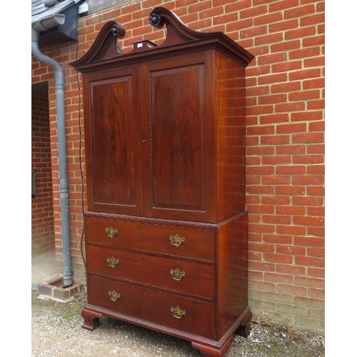 788 - A good George III mahogany linen press, the moulded cornice with broken and scrolled pediment, above... 