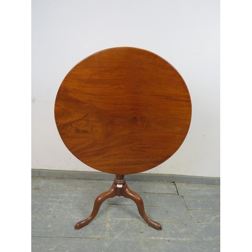 790 - An early Victorian mahogany tilt-top supper table of good colour, on a tapering turned pedestal with... 