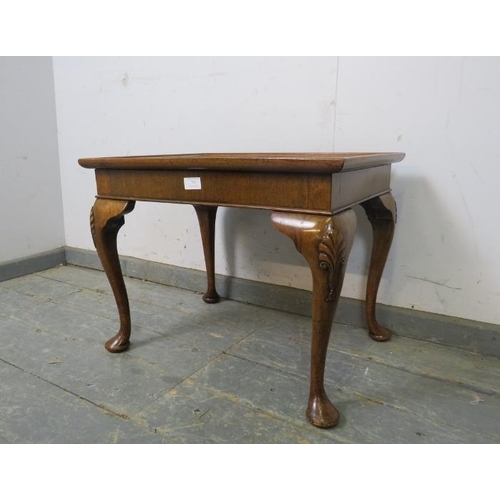 793 - An antique walnut coffee table, the quarter veneered top on shell carved cabriole supports. 
H59cm W... 