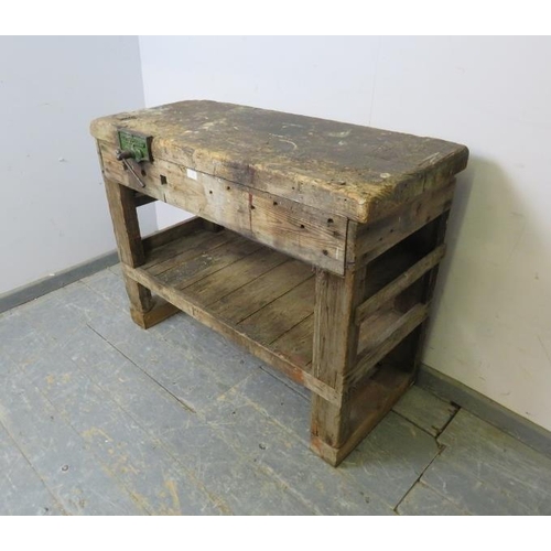 795 - An antique pine work bench of small proportions, fitted with a ‘Maples’ vice, on stile supports fitt... 