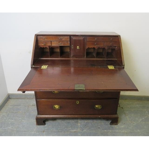 803 - A George III mahogany bureau, the fall front opening onto a fitted interior with document safe, abov... 