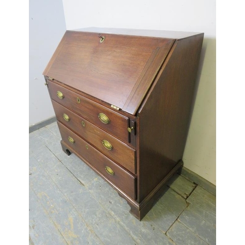 803 - A George III mahogany bureau, the fall front opening onto a fitted interior with document safe, abov... 