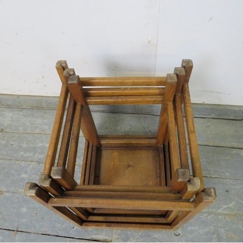 809 - An Art Deco Period walnut nest of three graduated stacking tables, on reeded square supports with st... 