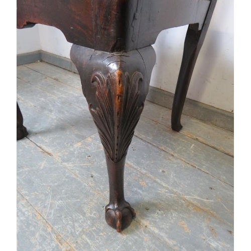 823 - A Georgian mahogany occasional chair, carved in the Chippendale taste, the drop-in seat pad upholste... 