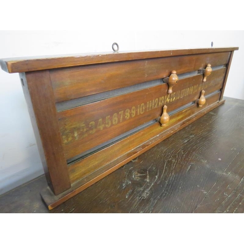 831 - An Edwardian mahogany billiards/snooker scoreboard, with gilt numerals and turned boxwood score mark... 