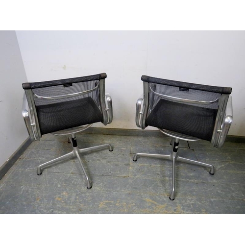 837 - 837	A pair of EA108 Charles Eames swivel desk chairs by Vitra, the cast aluminium frames with black ... 