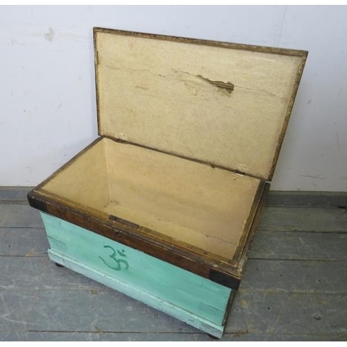 849 - An antique pine painted flat topped trunk/blanket box, metal bound and having carry handles to eithe... 