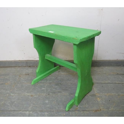 850 - An antique pine rustic stool, painted green, on shaped supports with middle stretcher. 
H48cm W44cm ... 