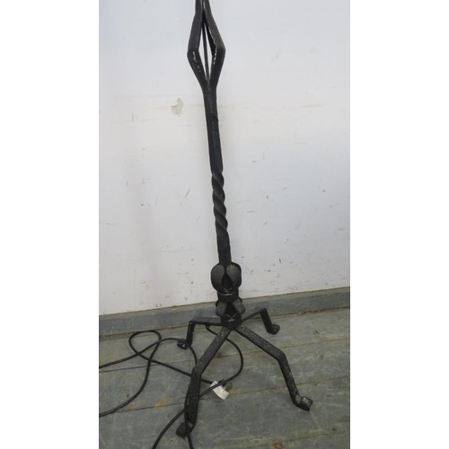 855 - A large vintage wrought iron reading lamp in the Gothic taste, on splayed supports. 
H193cm W46cm D3... 