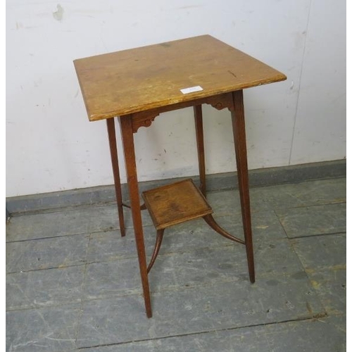 858 - An Arts & Crafts Period golden oak occasional table, on tapered square supports united by a gallerie... 