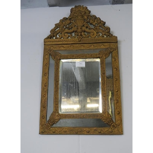 861 - A Napoleon III bevelled cushion mirror, the sectioned surround with ornate repousse decoration in th... 