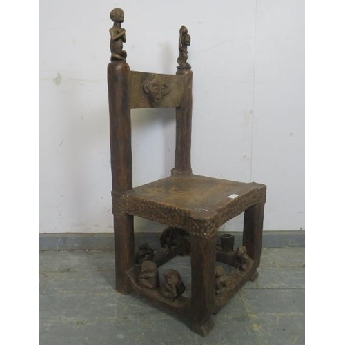 879 - A vintage African hardwood Chokwe tribal chief’s throne chair, the rawhide seat with metal studs, ha... 