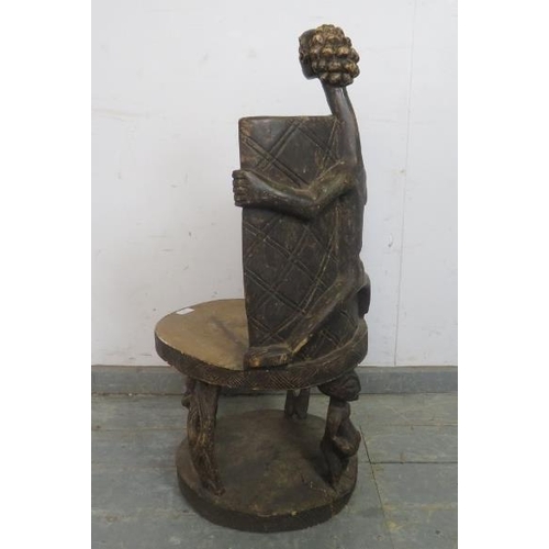 880 - A vintage African hardwood Tanzania Nyamwezi throne chair, having figural carved backrest and suppor... 