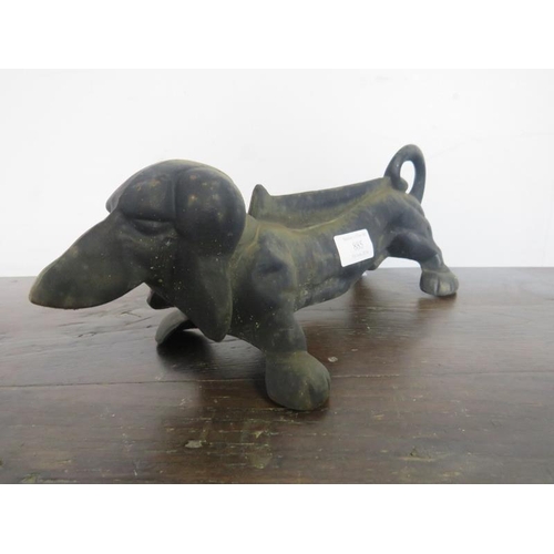 885 - A cast iron boot-scraper modelled as a dachshund. 
L33cm (approx).
Condition report: No issues.