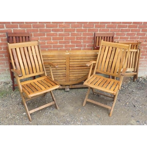 889 - A circular teak folding garden table, together with three folding teak armchairs by Chilworth Collec... 