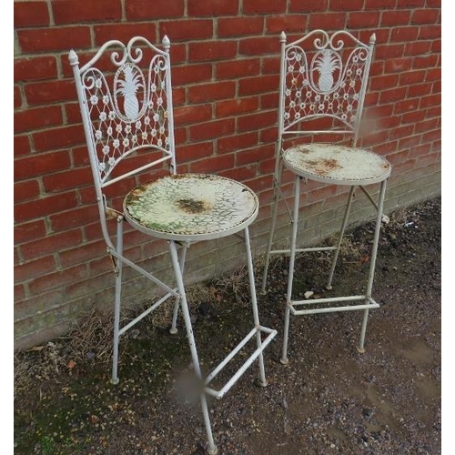 890 - A pair of heavy folding metal outdoor bar stools, the backrests with pierced pineapple decoration. 
... 