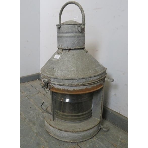 895 - A large antique galvanised ship’s masthead lantern, complete with internal burner and fittings.
H70c... 