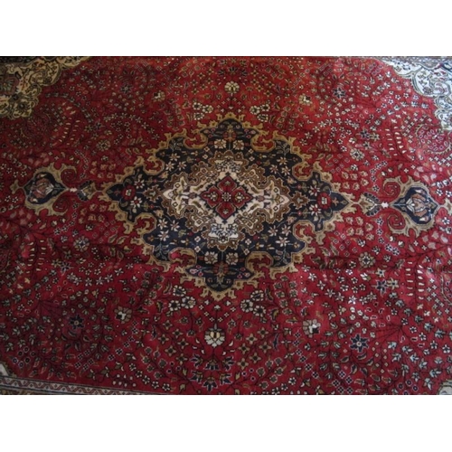 913 - A fine Persian Kashan carpet. Central medallion on red ground. 305cm x 79cm.
Condition report: Very ... 