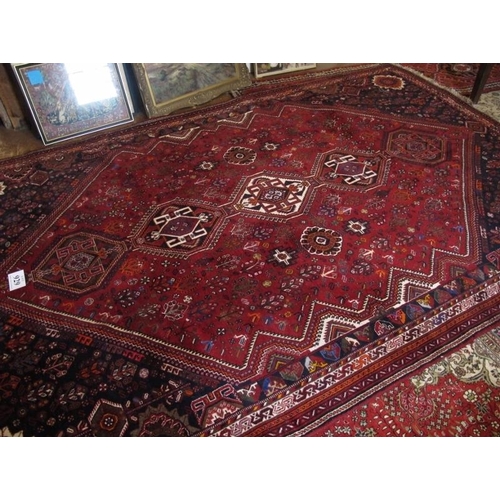 929 - A fine quality Persian carpet, central repeat medallions on red ground. 226cm x 340cm (approx).
Cond... 