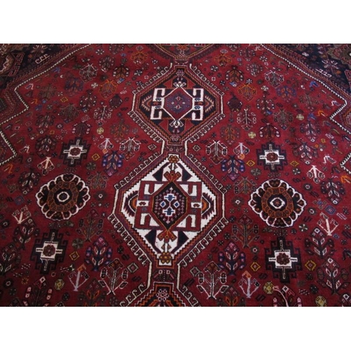 929 - A fine quality Persian carpet, central repeat medallions on red ground. 226cm x 340cm (approx).
Cond... 