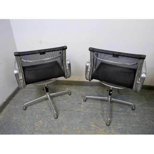 838 - A pair of EA108 Charles Eames swivel desk chairs by Vitra, the cast aluminium frames with black mesh... 