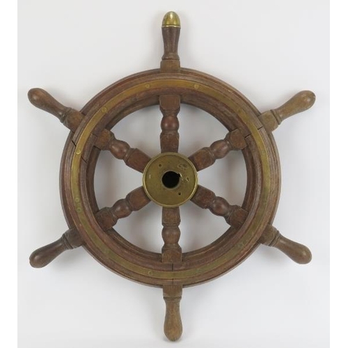 111A - Maritime: An oak and brass six spoke ship’s wheel, probably late 19th/early 20th century. 62.5 cm wi... 