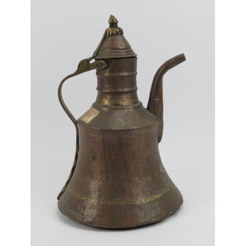 105 - A Middle Eastern brass and copper dallah, 19th century or possibly earlier. 33.5 cm height. Conditio... 