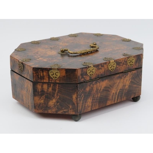 16 - A French musical sewing box, 19th century. Of elongated octagonal form, the hinged cover opening to ... 